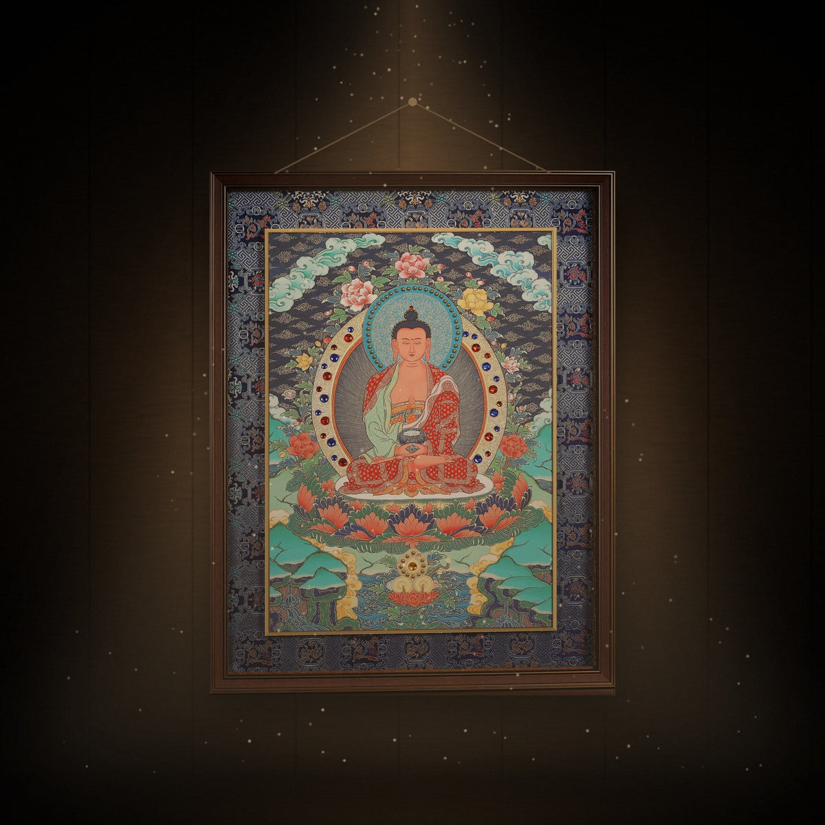 Framed Amitabha Buddha thangka hanging in a quiet room under warm light