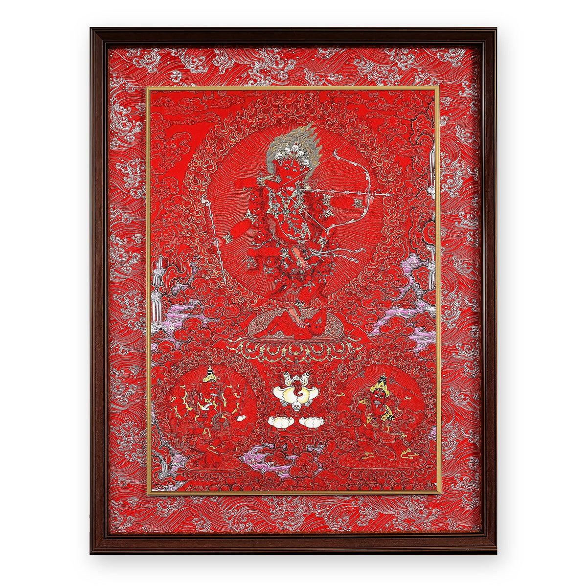 Kurukulla red thangka drawing a bow of flowers, framed in Crimson Cloud silk brocade, on a white background