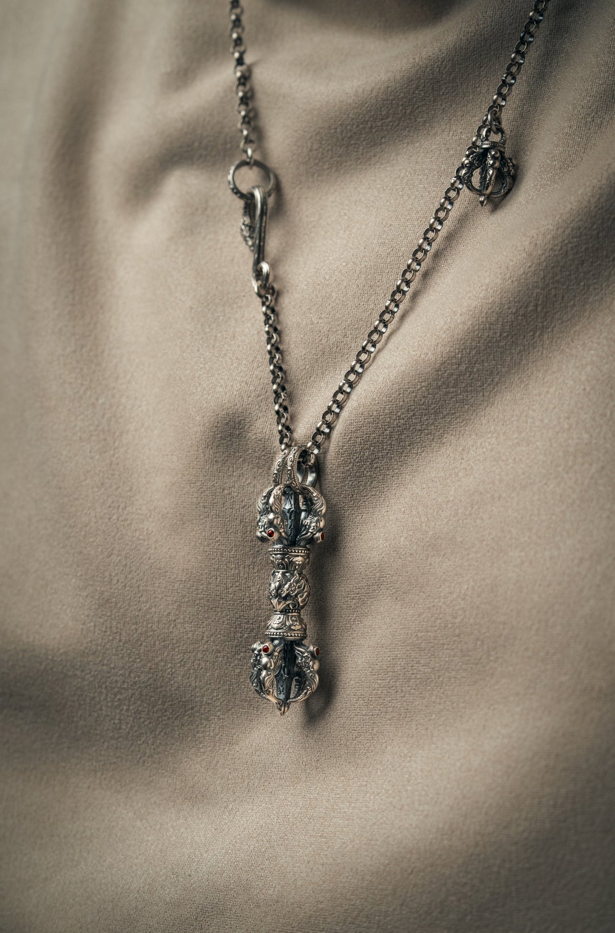 Pure silver garuda vajra pendant hanging on its titanium bead chain