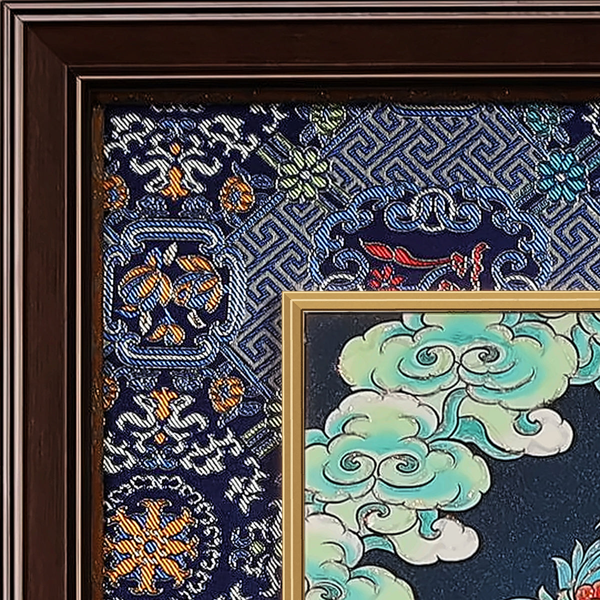 Akashagarbha thangka detail: corner of the blue silk brocade frame-within-a-frame