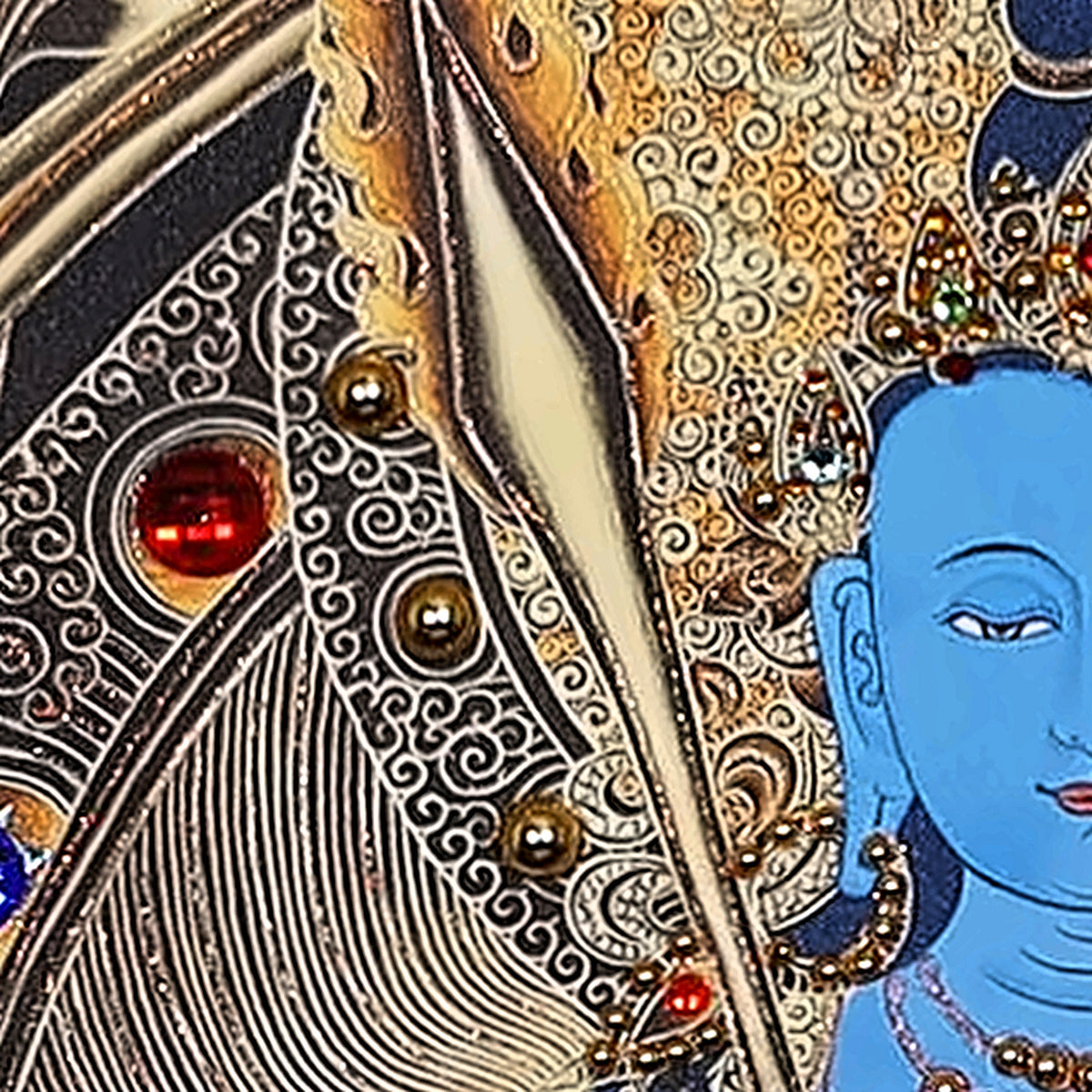 Akashagarbha thangka detail: sword blade beside his face