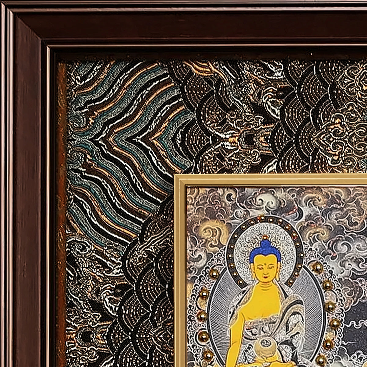Amitabha thangka detail: corner of the black and gold silk brocade frame-within-a-frame