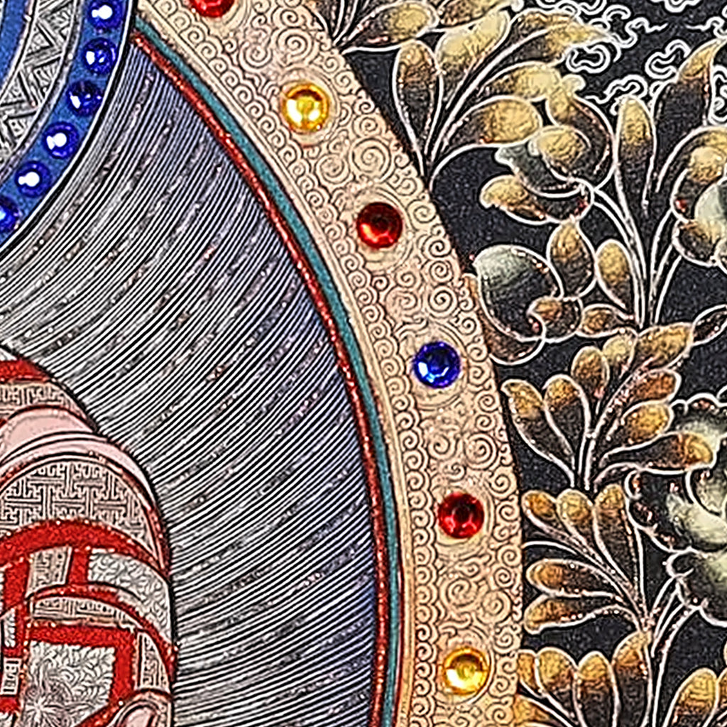 Amitabha thangka detail: red, yellow and blue crystals set along the gold mandorla