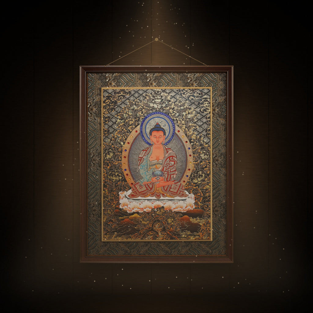 Amitabha black and gold thangka hanging in a room under warm light