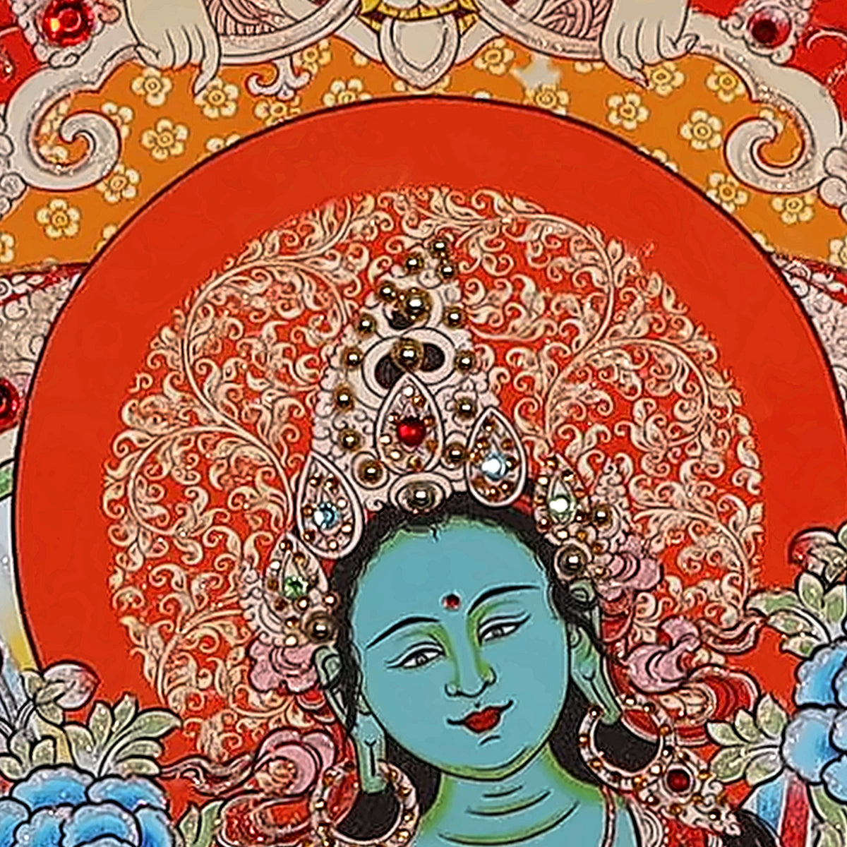 Green Tara thangka detail: face with five-jewelled crown inside an orange halo