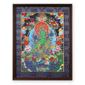 Green Tara thangka on a night-blue ground with peonies, framed in Night Sky silk brocade, on a white background