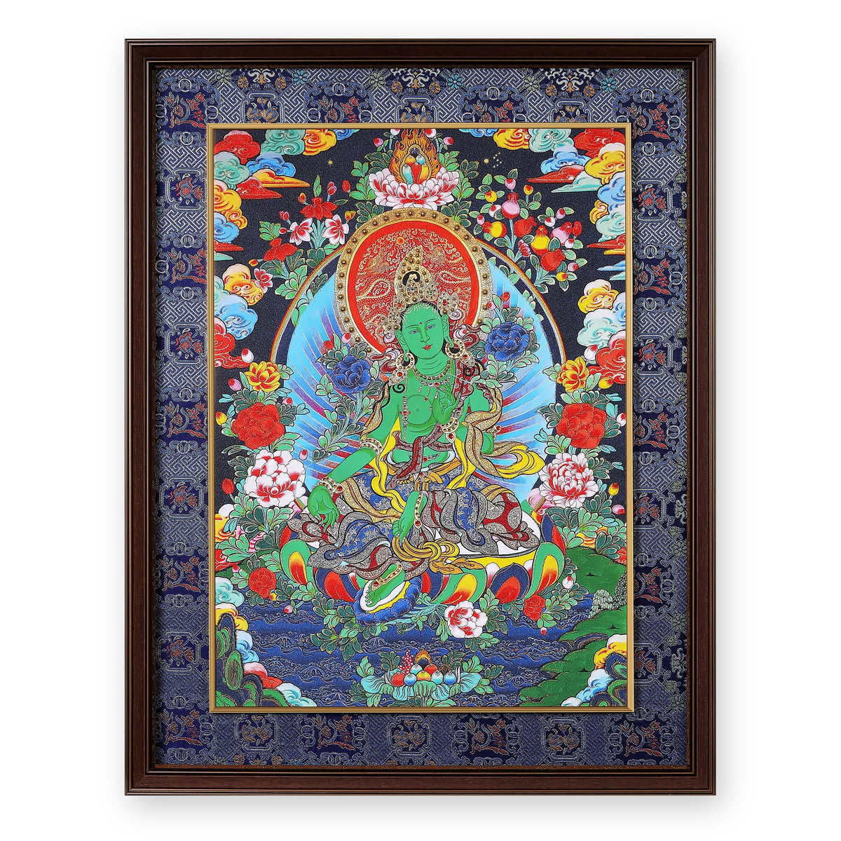 Green Tara thangka on a night-blue ground with peonies, framed in Night Sky silk brocade, on a white background