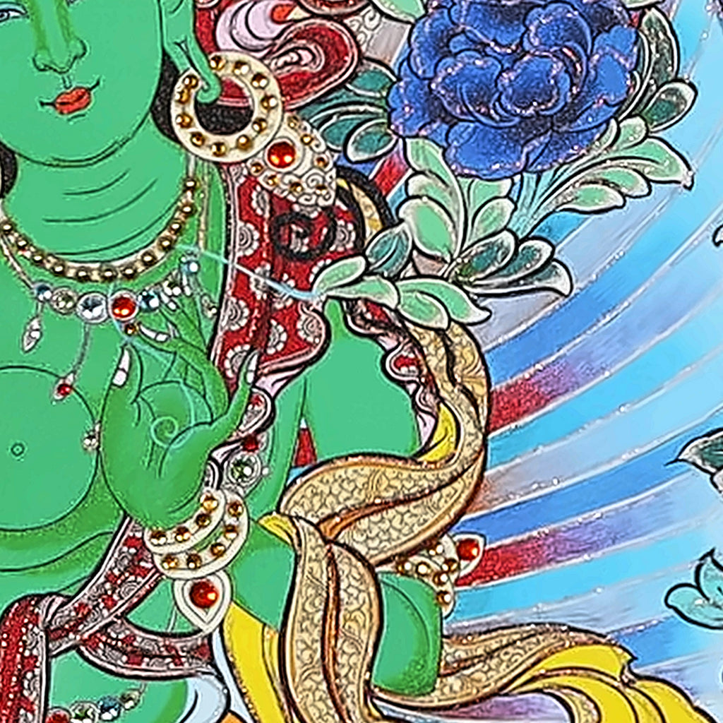 Green Tara thangka detail: left hand at her heart holding a flower stem
