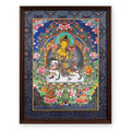 Lion's Roar Manjushri thangka on a white snow lion, framed in Night Sky silk brocade, on a white background