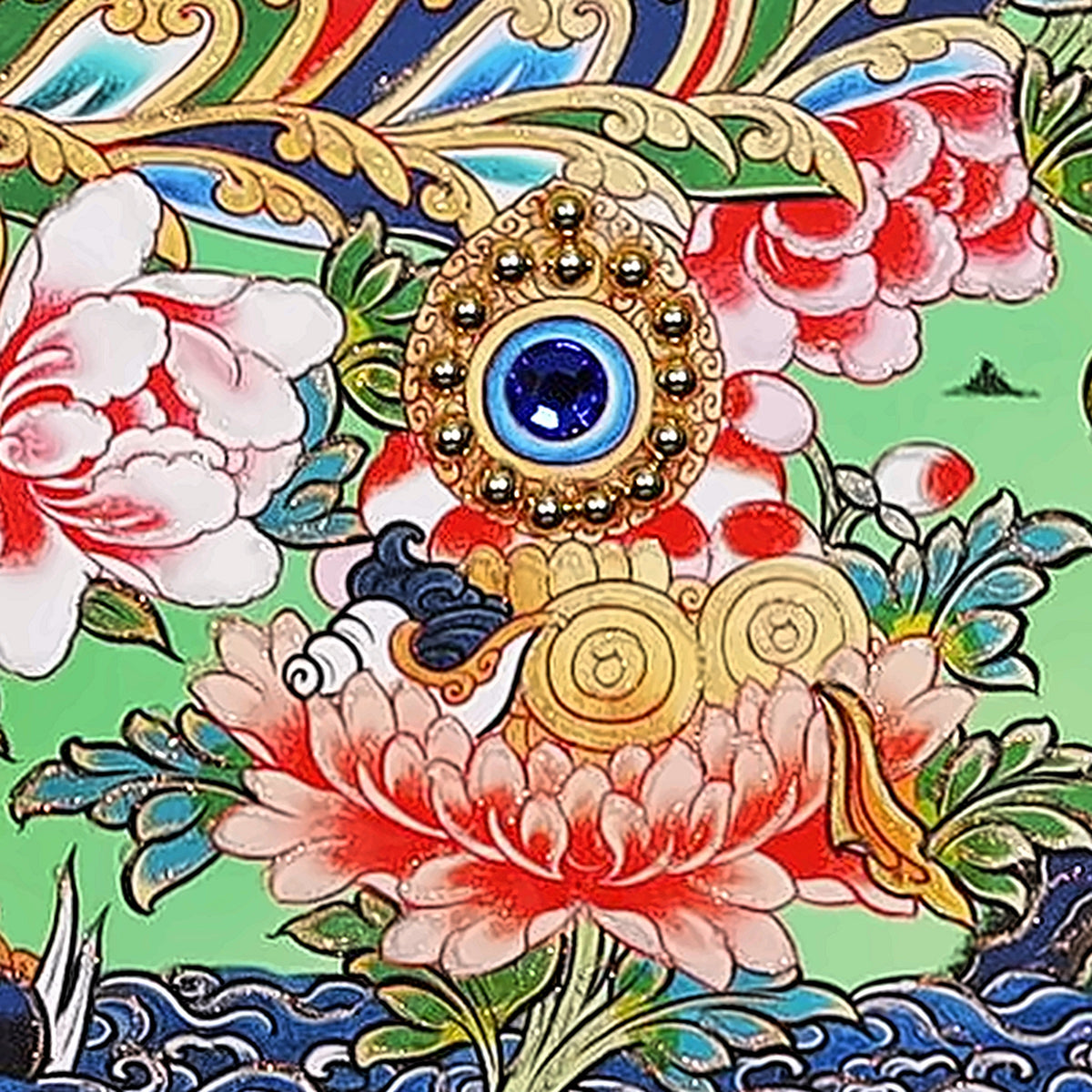 Lion's Roar Manjushri thangka detail: jewel offering set with a blue crystal on a lotus