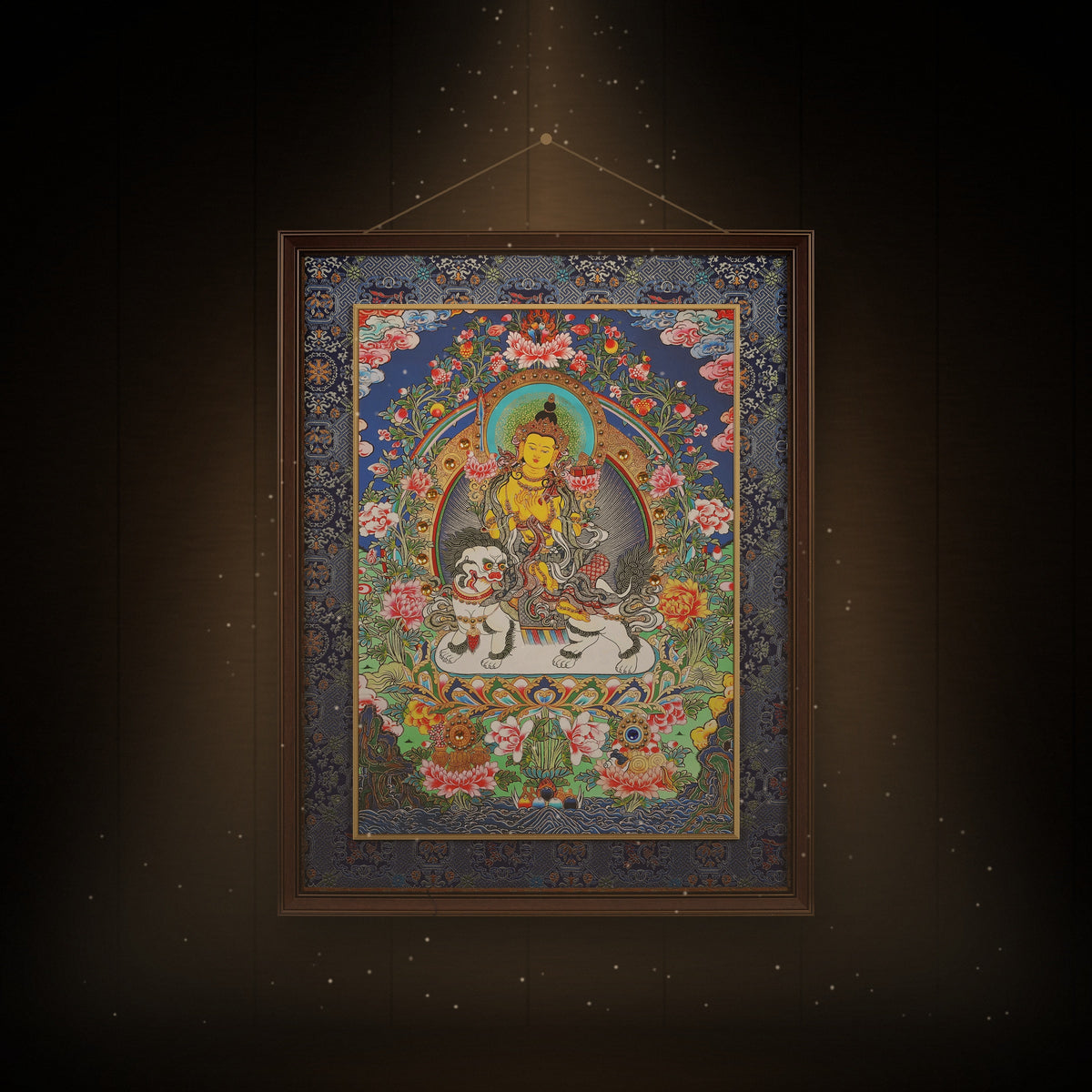 Lion's Roar Manjushri thangka hanging in a room under warm light