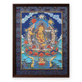 Manjushri thangka with flaming sword on a night-blue ground, framed in Night Sky silk brocade, on a white background
