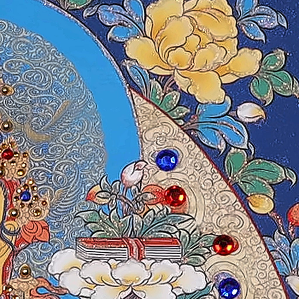 Manjushri thangka detail: book of wisdom resting on a lotus at his shoulder