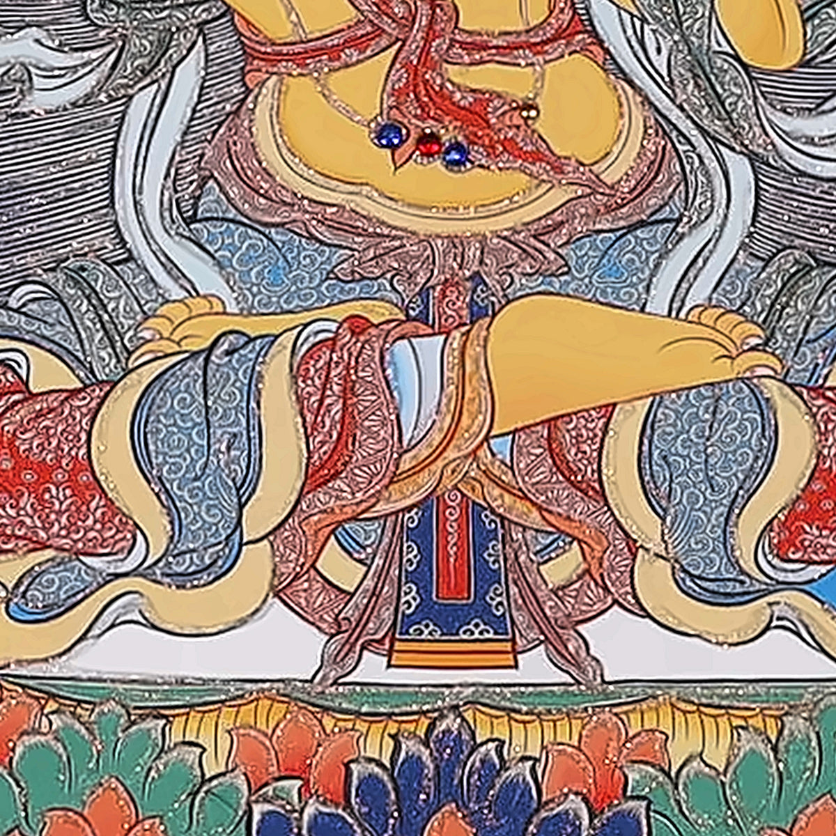 Manjushri thangka detail: crossed legs on the red and blue lotus throne