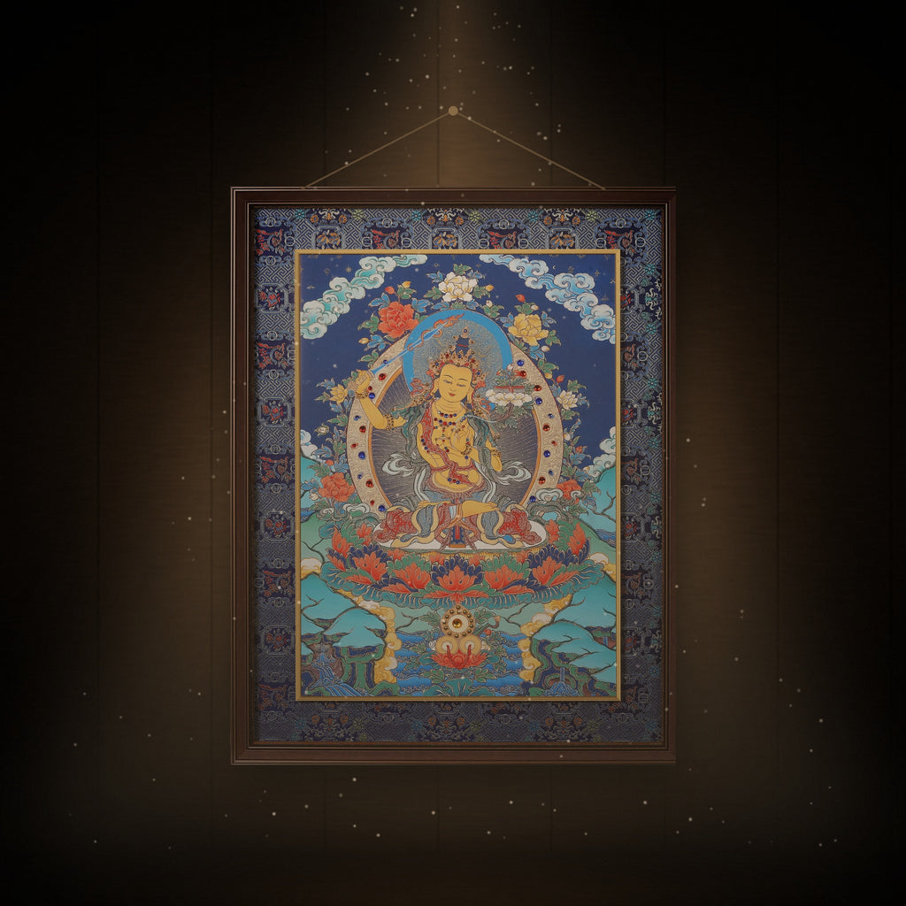 Manjushri thangka hanging in a room under warm light