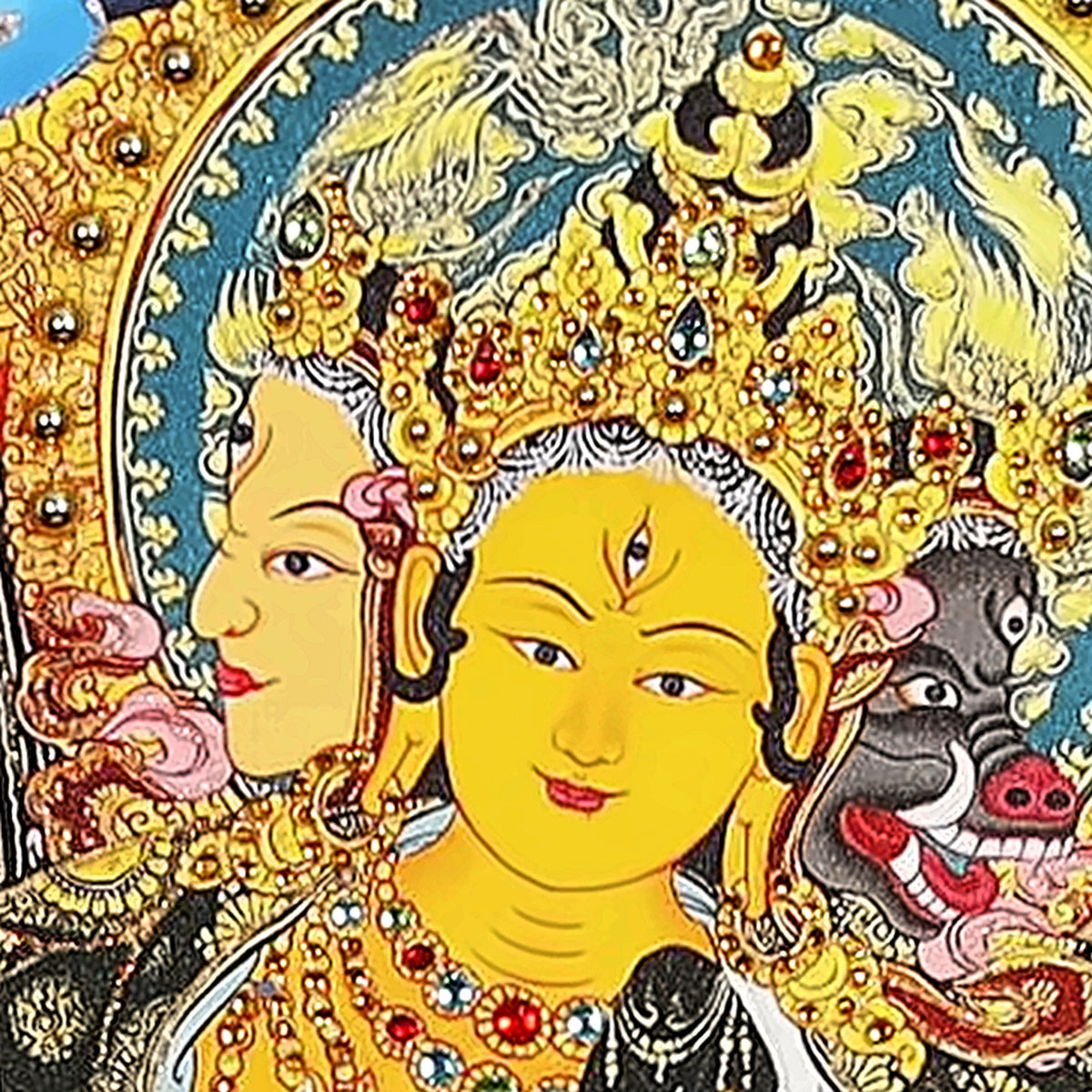 Marici thangka detail: three faces, golden, white and the dark face of a sow