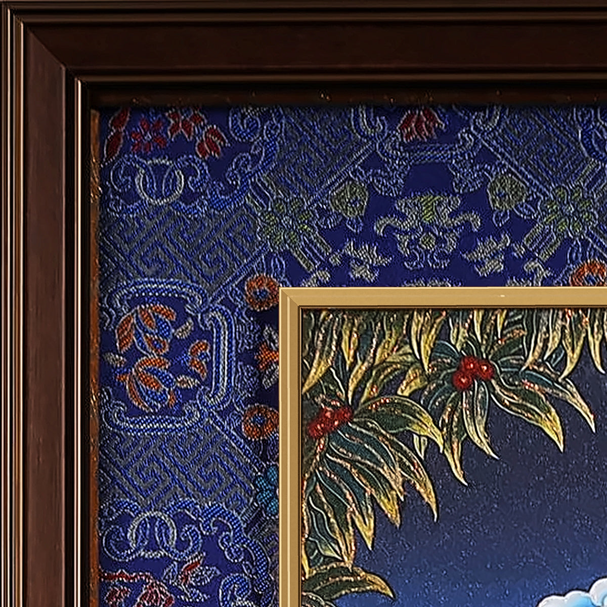 Marici thangka detail: corner of the blue silk brocade frame-within-a-frame