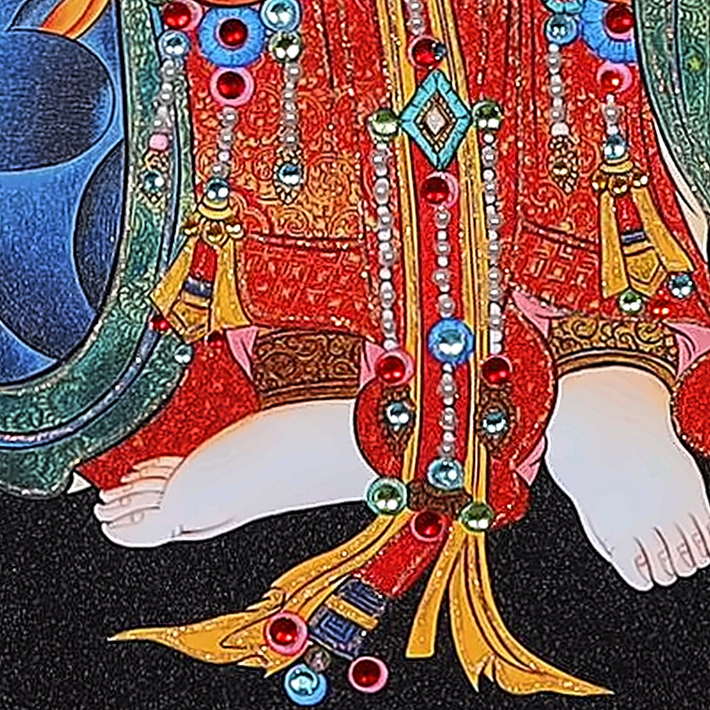 Marici thangka detail: feet on the lotus, red skirt hung with jewels