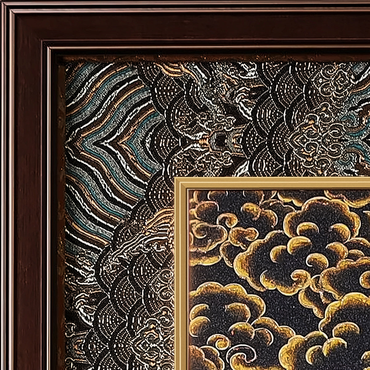 Marici thangka detail: corner of the black and silver silk brocade frame-within-a-frame