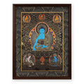 Medicine Buddha black and gold thangka with Shakyamuni, Amitabha and Ratnasambhava above and two female protectors below, framed in Ink & Gold silk brocade, on a white background