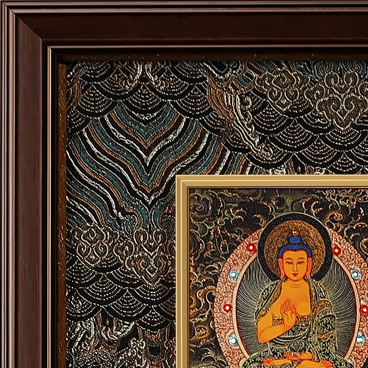 Medicine Buddha thangka detail: corner of the black and silver silk brocade frame-within-a-frame