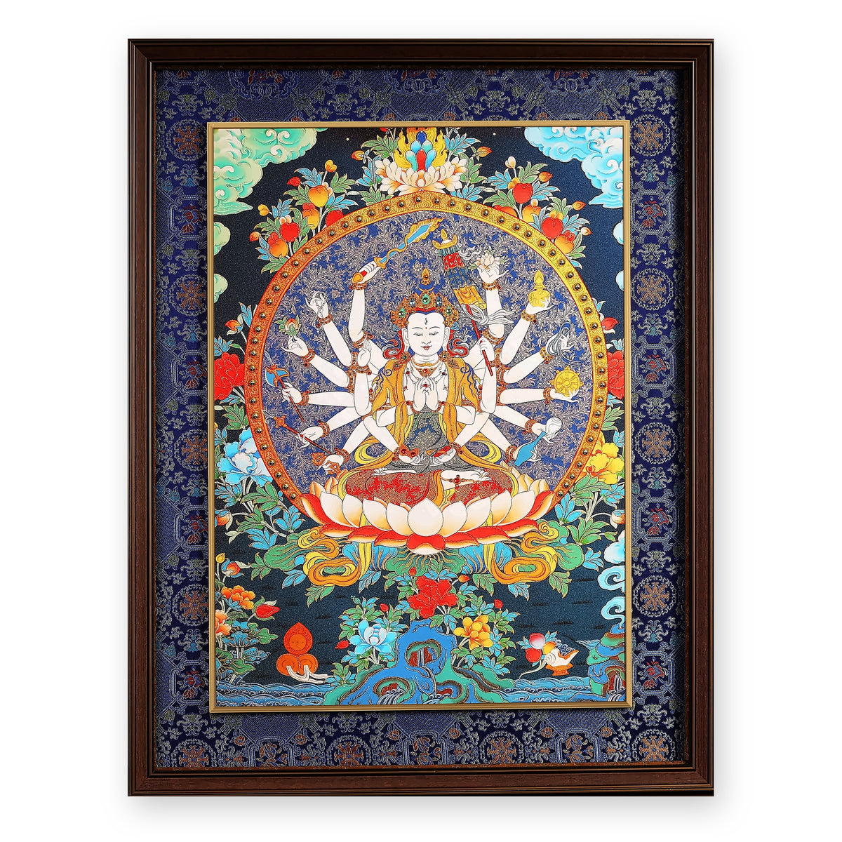 Cundi (Zhunti) thangka, white and eighteen-armed on a lotus, framed in Night Sky silk brocade, on a white background