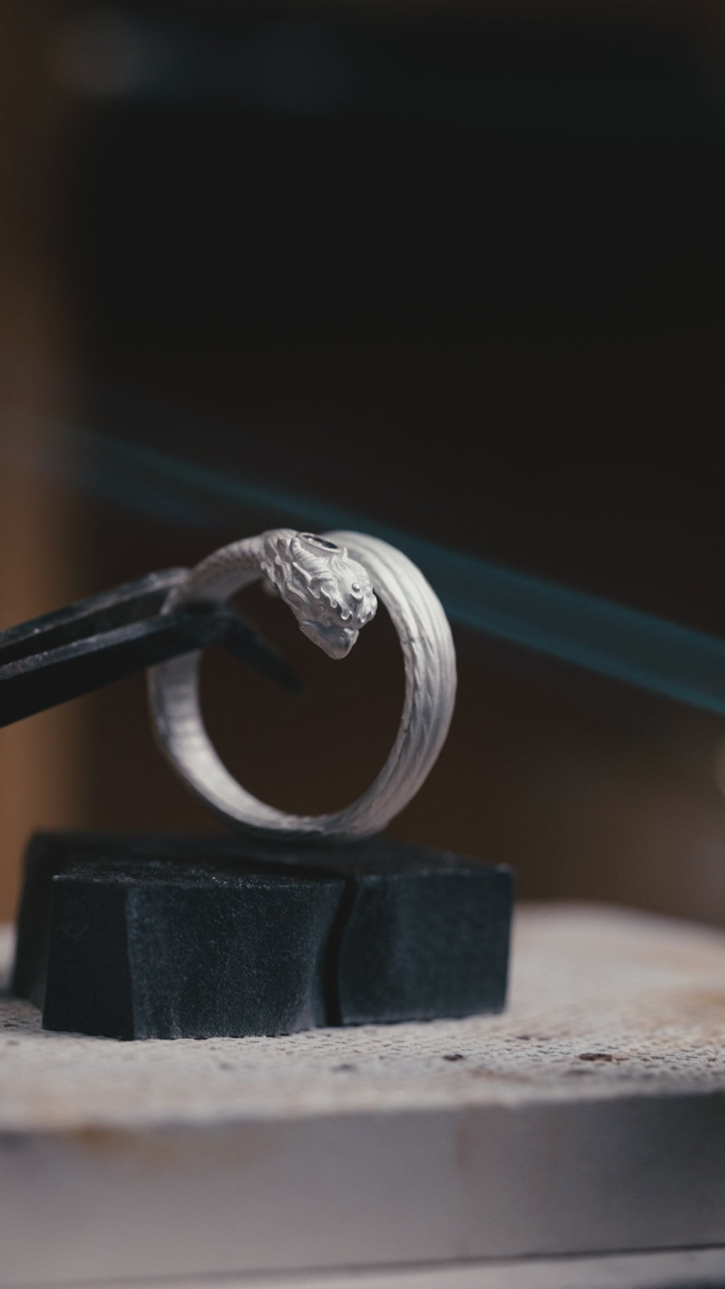 Garuda garnet pinky ring video – slim sterling silver open band with fire-gilded brows, horns and band line