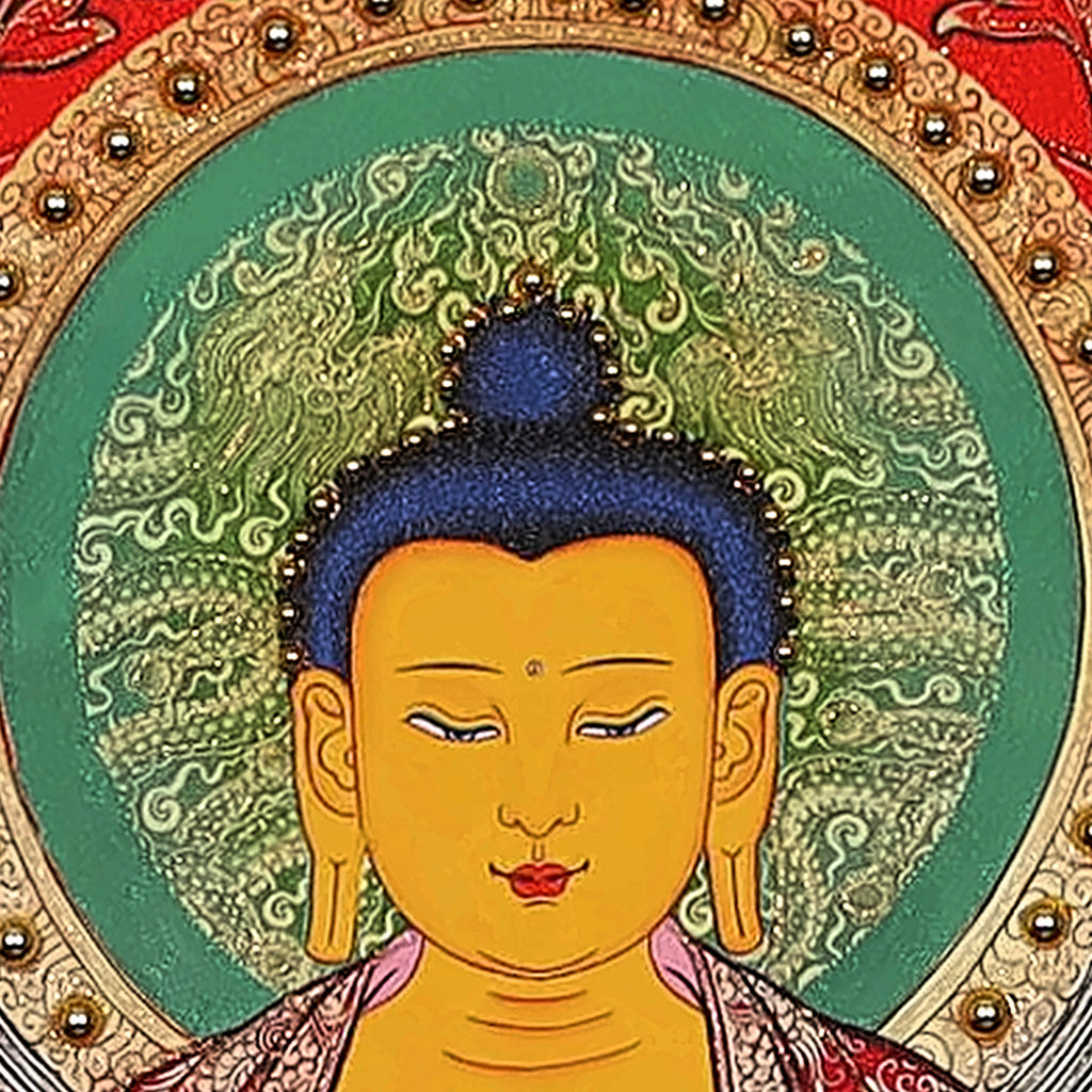 Shakyamuni thangka detail: face and blue hair inside a green halo edged with gold beads