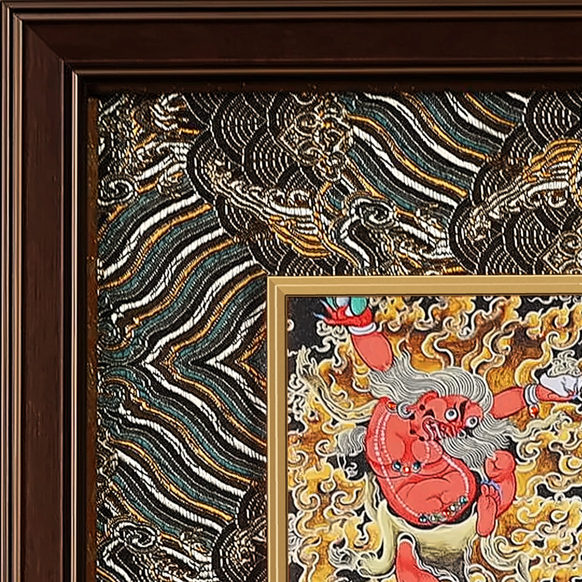Six-Armed Mahakala thangka detail: corner of the black and silver silk brocade frame-within-a-frame