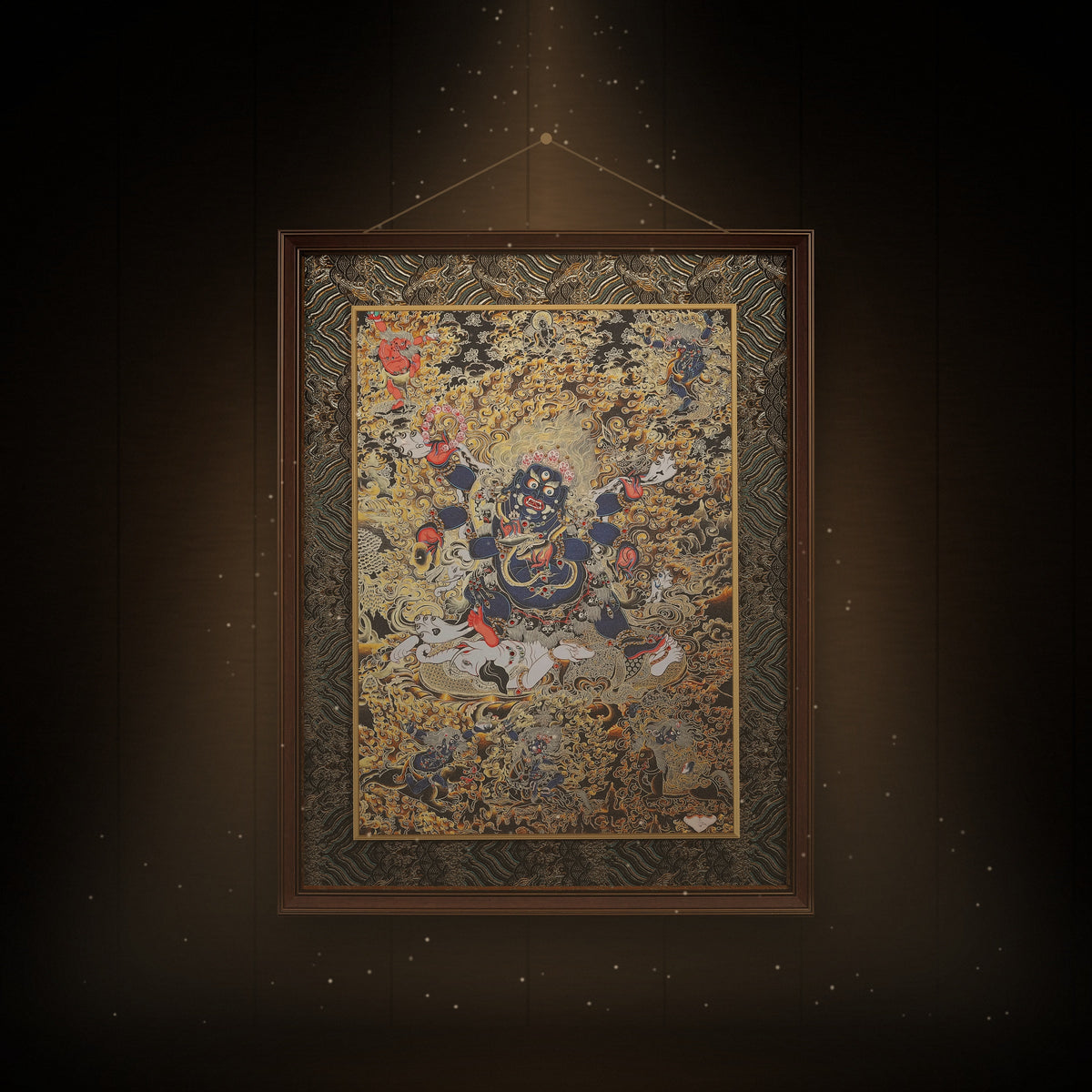 Six-Armed Mahakala black and gold thangka hanging in a room under warm light