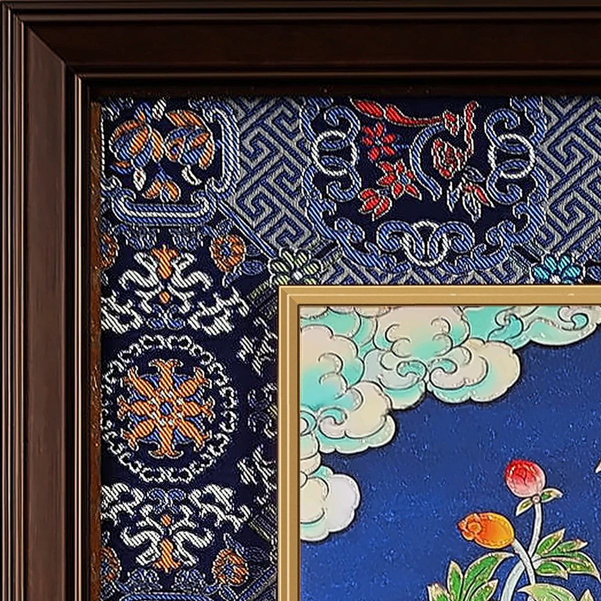 Vairocana thangka detail: corner of the blue silk brocade frame-within-a-frame
