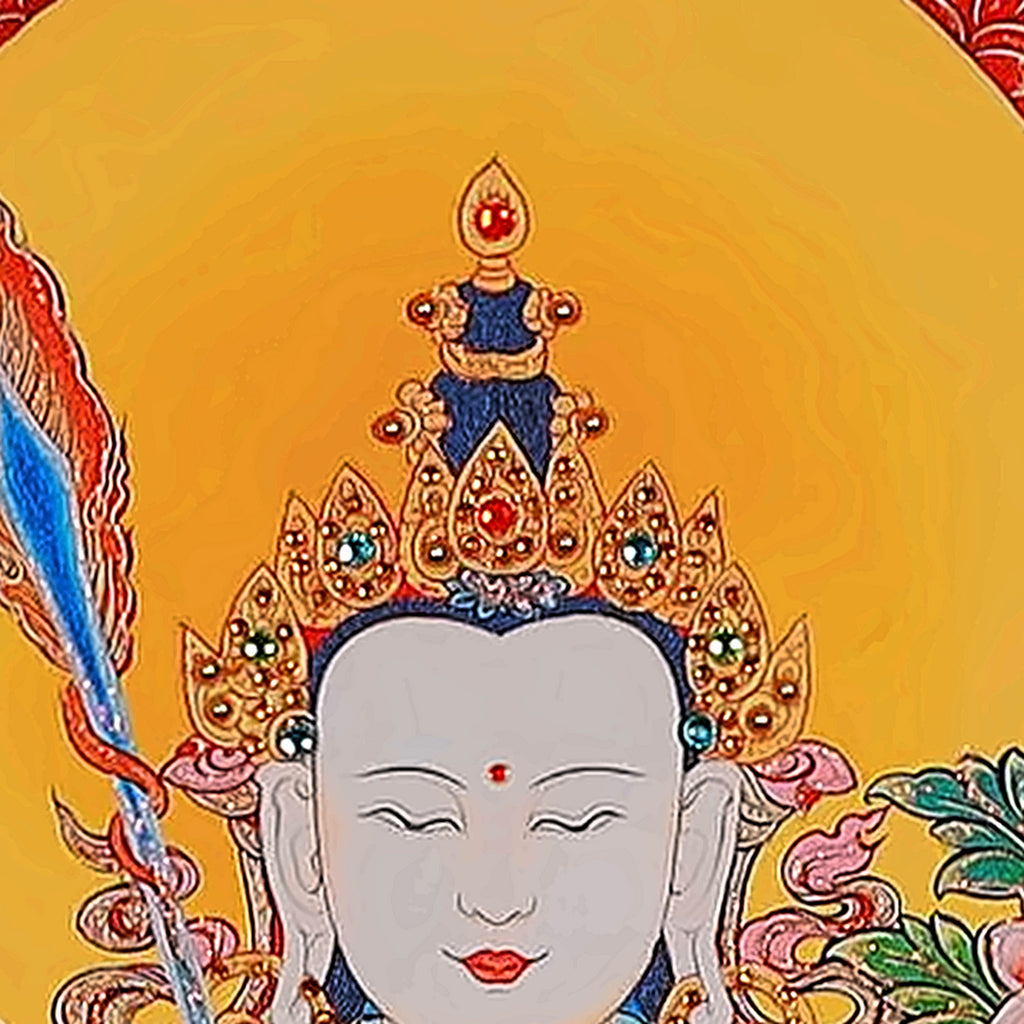 White Manjushri thangka detail: white face under a golden halo and crown