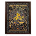 Yellow Jambhala black and gold thangka, framed in Ink & Gold silk brocade, on a white background