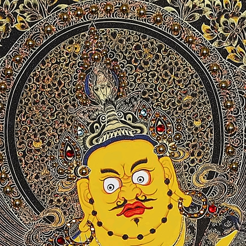 Yellow Jambhala thangka detail: face with round eyes and curled moustache under a crown
